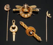 A small mixed collection of jewellery, including an antique moon and star stick pin,