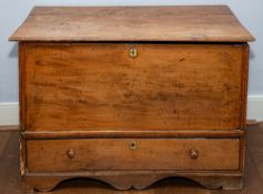 A George III stained beech and ash mule chest, circa 1770; the hinged lid with moulded edges,