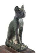 AN EGYPTIAN BRONZE MODEL OF A CAT, LATE PERIOD, CIRCA 600 B.C. incised decoration on forelegs, 7cm.
