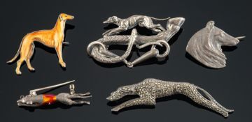 A group of five greyhound and dog related brooches, including a greyhound brooch,