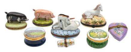A collection of enamelled metal and porcelain boxes,