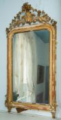 A giltwood and composition framed wall mirror in Louis XV style,