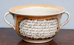 A Sunderland orange lustre chamber pot of two handled form,