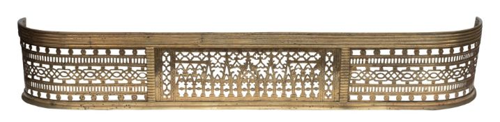 A Regency pierced brass fender, early 19th century; of 'D' section,