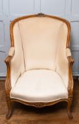 A pair of carved wood and upholstered wing canapé chairs in Louis XV style,