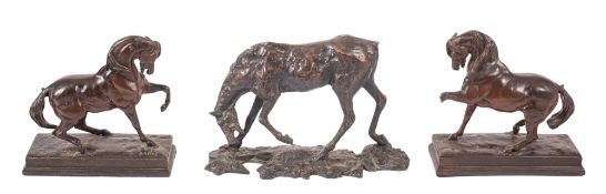 A group of seven equestrian models, all in simulated bronze,
