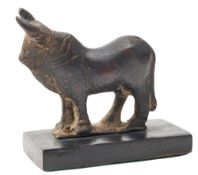 A ROMAN BRONZE MODEL OF A BULL, CIRCA 1ST-2ND CENTURY A.D.,