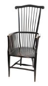 An ebonised beech comb back elbow chair,