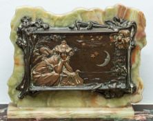 A French patinated bronze and onyx mounted table screen in Art Nouveau style,