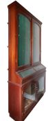 A mahogany and glazed gun cabinet in Victorian taste,