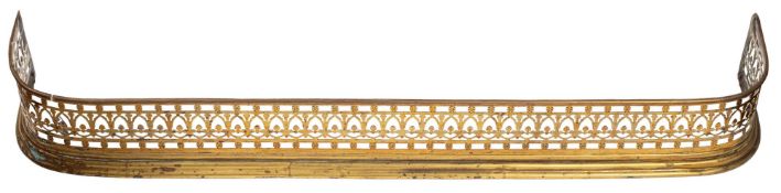 A Regency pierced brass fender,