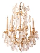 A silvered metal and glass hung nine light chandelier, in Louis XV taste, second half 20th Century,