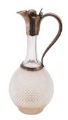 A Victorian silver mounted clear cut-glass claret jug, of baluster form,