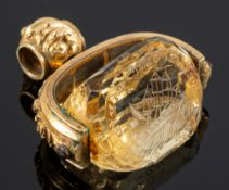 A 19th century yellow metal and citrine intaglio fob seal,
