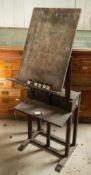 A stained wood artist's easel stand,