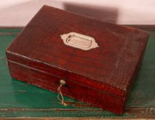 Pittway Brothers, London; an Edwardian crocodile leather cased travelling dressing set;