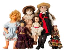 A group of various 20th century dolls including a porcelain head doll of girl in a school uniform