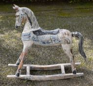 A carved and painted wood rocking horse, modern; 91cm high,