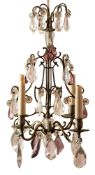 A metal and glass hung four light chandelier in Louis XV taste,