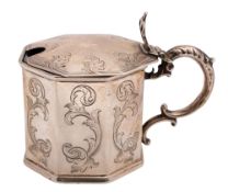 A Victorian silver mustard pot, octagonal form, with engraved decoration and a blue glass liner,