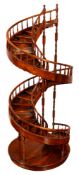 A walnut library model of a spiral staircase,