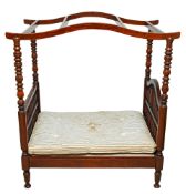 A doll's stained beech four-post bed,