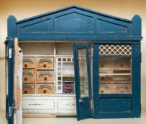 An early 20th century dolls house shop,