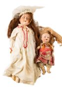 An Armand Marseille bisque head doll, brown wig, brown glass sleeping eyes,