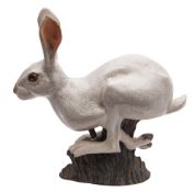 Brian Andrew [Contemporary] a slip cast raku fired hare modelled in running posture,