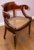 A Louis Philippe brass mounted mahogany desk chair, circa 1835; with tub back,
