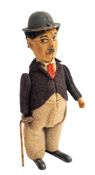 An early 20th century clockwork Charlie Chaplin figure,