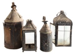 A group of four early sheet iron lanterns, 19th century; the largest example,