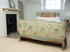 A fabric adorned and pale blue painted wood double bed,