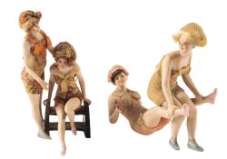 Two pairs of early 20th century bisque bathing figures in the manner of Galluba & Hoffman,