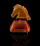 A Continental amber coloured glass and hardstone mounted model of the head of a horse,