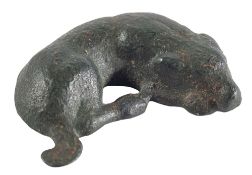 A ROMAN BRONZE MODEL OF A SLEEPING HOUND, CIRCA 2ND CENTURY A.D.,