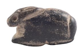 A MESOPOTAMIAN BLACK STONE HARE AMULET CIRCA 3RD MILLENNIUM B.C. drilled for suspension, 3.8cm.