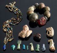 A small quantity of amulets, beads and other jewellery items,