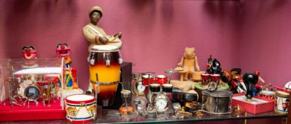 A collection of various miniature drums,