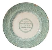 A commemorative pottery plate transfer decorated in green with a panel for Teignbridge Cricket Club