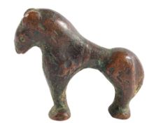 AN ISLAMIC BRONZE MODEL OF A STYLISED HORSE, CIRCA 9TH CENTURY A.D.,