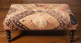 A stained beech and kelim flatweave upholstered centre stool, 20th century, of rectangular form,