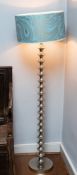 A chromium plated standard lamp,