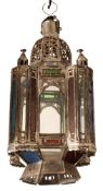 A near pair of metal and glazed mosque lanterns,