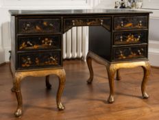 A black japanned and parcel giltwood desk in early 18th century style,