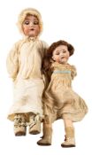 A Kammer & Reinhardt bisque head baby doll, blonde wig, brown glass sleeping eyes,