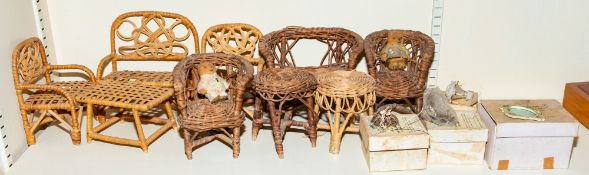 A collection of early 20th century and later dolls house cane furniture together with two Shackman