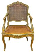A pair of Louis XV style carved and polychrome painted wood fauteuils,