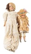 A Simon & Halbig bisque head doll, brown wig, brown glass sleeping eyes,