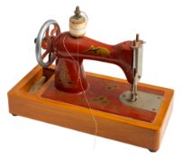 A collection of various dolls house furniture comprising a cast iron stove, display cabinet,